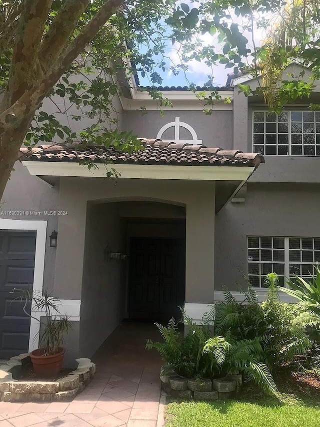 property entrance with a garage