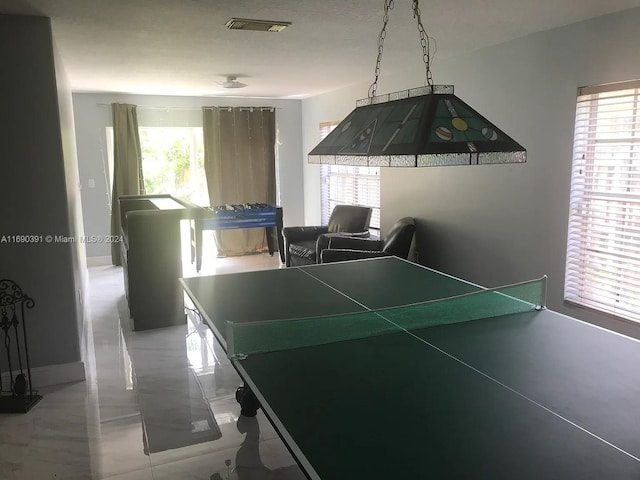 recreation room with a healthy amount of sunlight