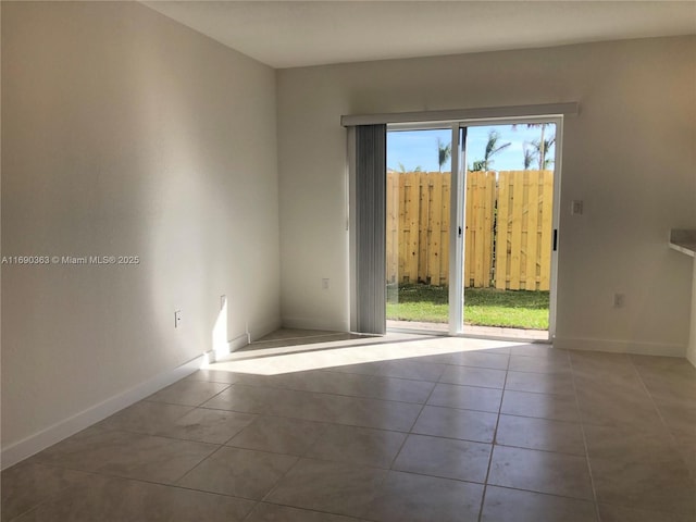 spare room featuring tile patterned flooring