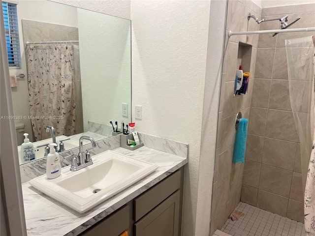 bathroom with vanity, toilet, and a shower with shower curtain