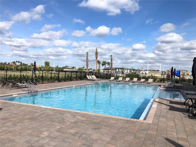 view of swimming pool featuring a patio area