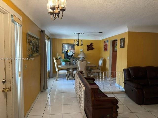 4325 NW 27th St, Lauderhill, FL 33313 - living area featuring a chandelier, light tile patterned flooring, and a textured ceiling