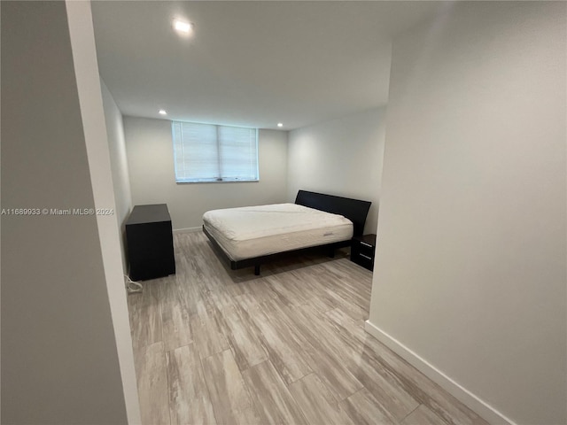 bedroom with light hardwood / wood-style flooring