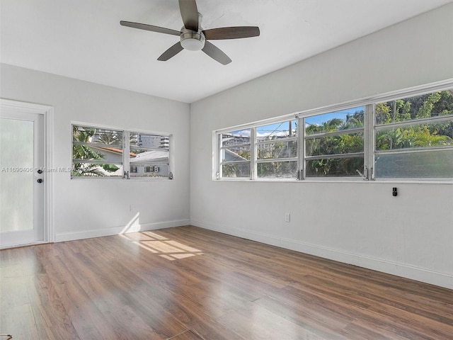 spare room with wood-type flooring and ceiling fan