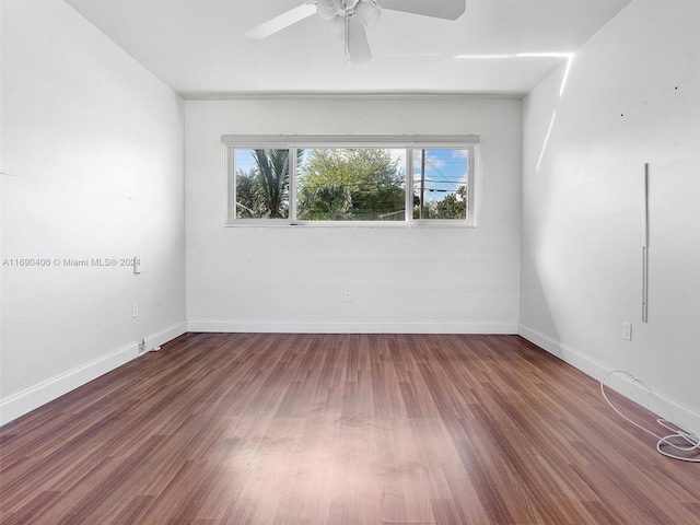 unfurnished room with ceiling fan and wood-type flooring