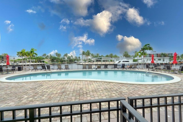 view of swimming pool featuring a patio