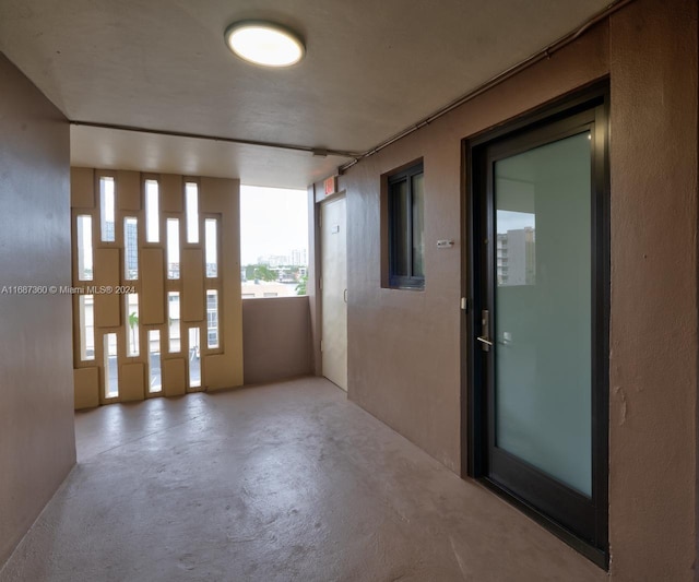 hallway with concrete flooring