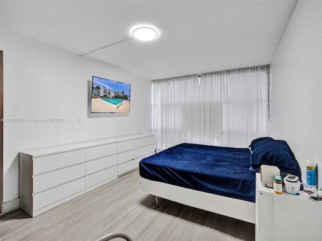 bedroom with light wood-type flooring