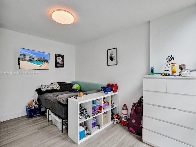 bedroom with light hardwood / wood-style flooring