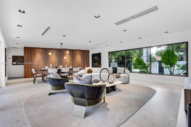 living room featuring wood walls