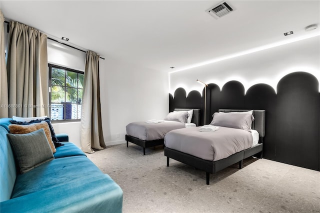 bedroom with visible vents and baseboards