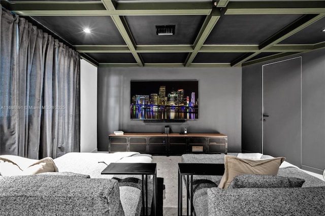 cinema room with visible vents, coffered ceiling, and beamed ceiling