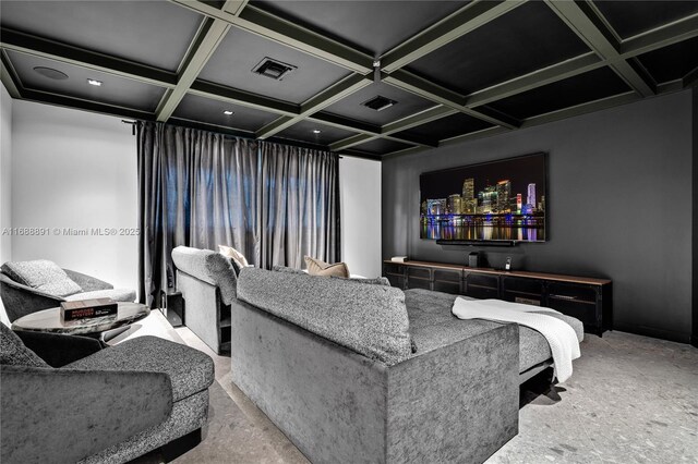 cinema featuring visible vents, coffered ceiling, and beam ceiling