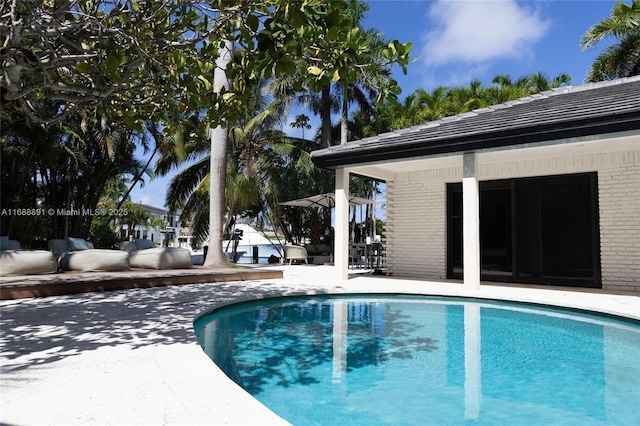 pool with a patio