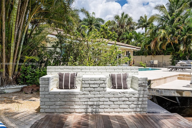 exterior space with fence and a pool