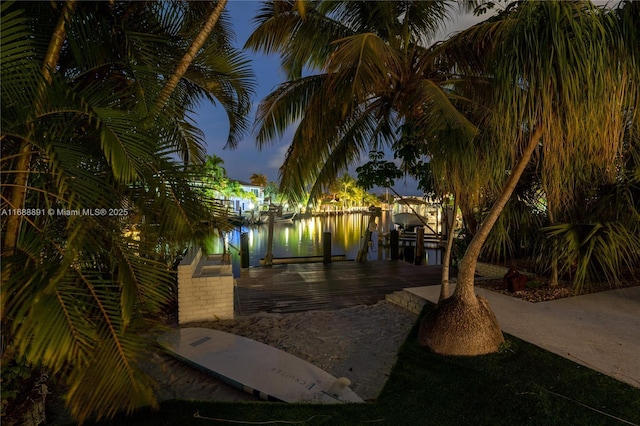 exterior space with a dock and boat lift