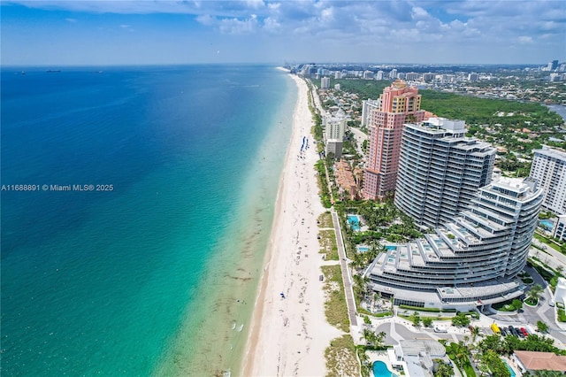 aerial view with a view of city, a water view, and a beach view