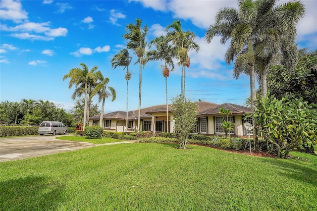 single story home featuring a front yard