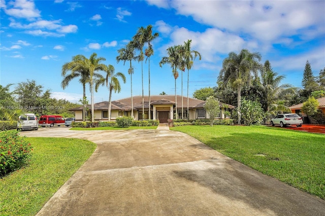 single story home featuring a front lawn