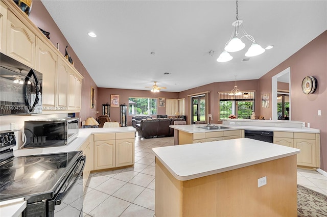 kitchen with a kitchen island, kitchen peninsula, and plenty of natural light