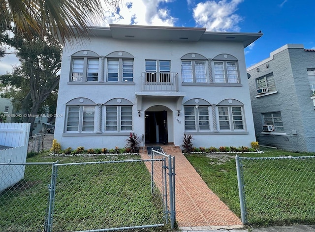 view of front of property with a front lawn and cooling unit