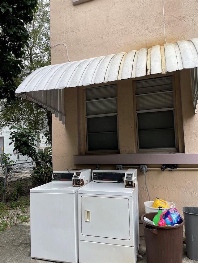 washroom with separate washer and dryer