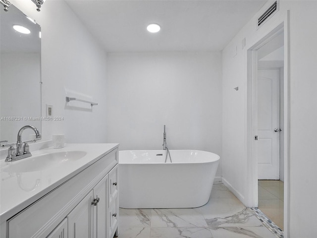 bathroom with a bathtub and vanity