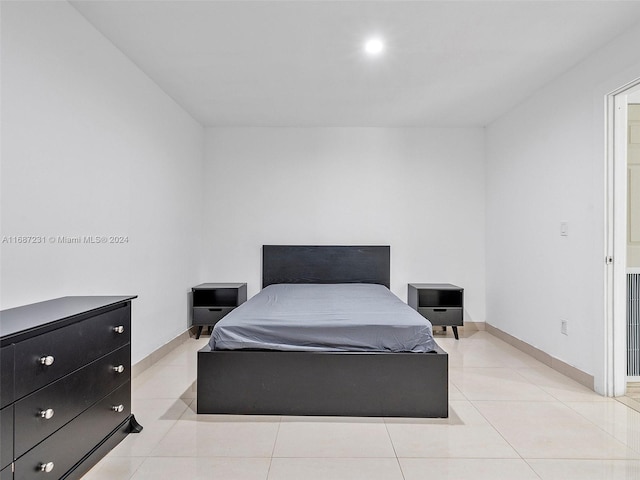 bedroom featuring light tile patterned floors