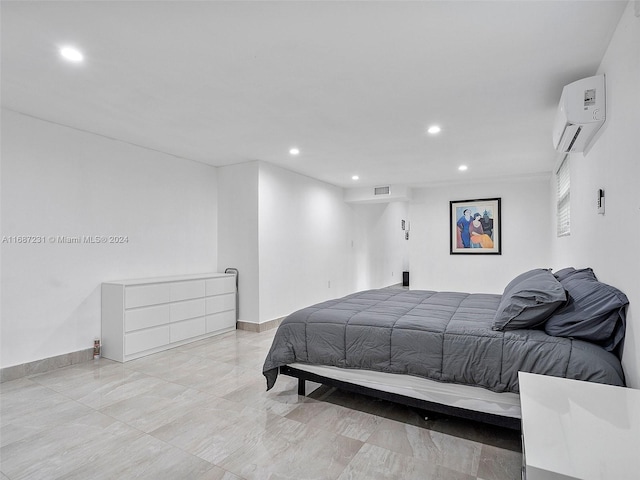 bedroom featuring a wall mounted AC