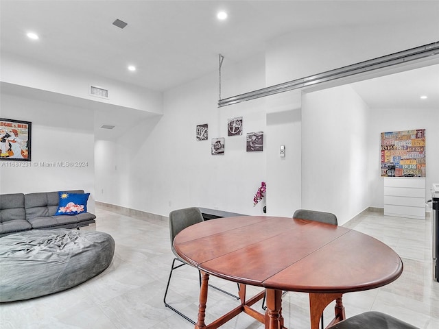 dining room with vaulted ceiling