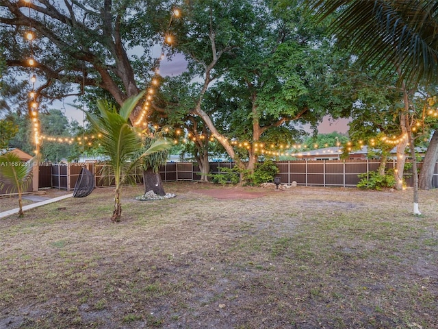 view of yard at dusk