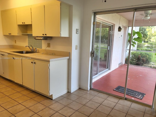 kitchen featuring ceiling fan, sink, and light tile patterned floors