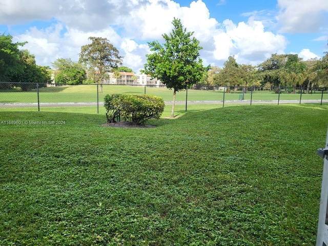 view of community featuring a yard