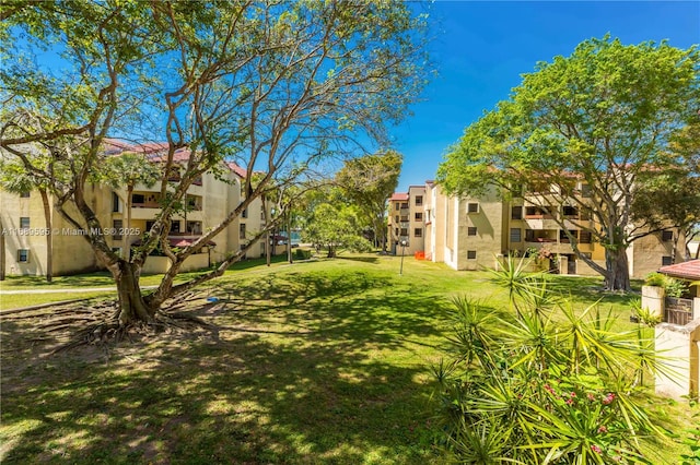 view of community with a yard and a residential view