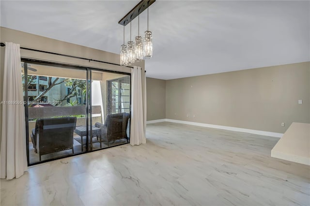 kitchen with pendant lighting, appliances with stainless steel finishes, and sink