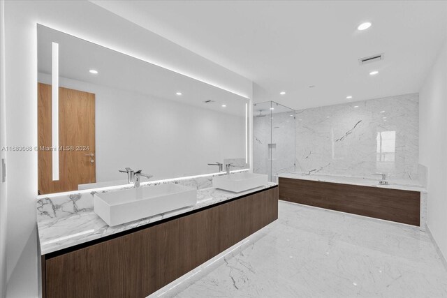 1135 103rd St Unit 403, Bay Harbor Islands, FL 33154 - full bath with recessed lighting, double vanity, and marble tiled floors