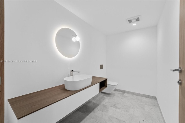 1135 103rd St Unit 403, Bay Harbor Islands, FL 33154 - bathroom with vanity, marble finish floors, and recessed lighting