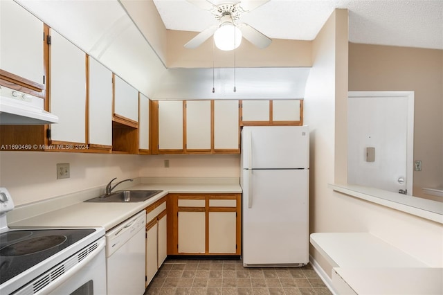 kitchen with range hood, white cabinetry, sink, white appliances, and ceiling fan