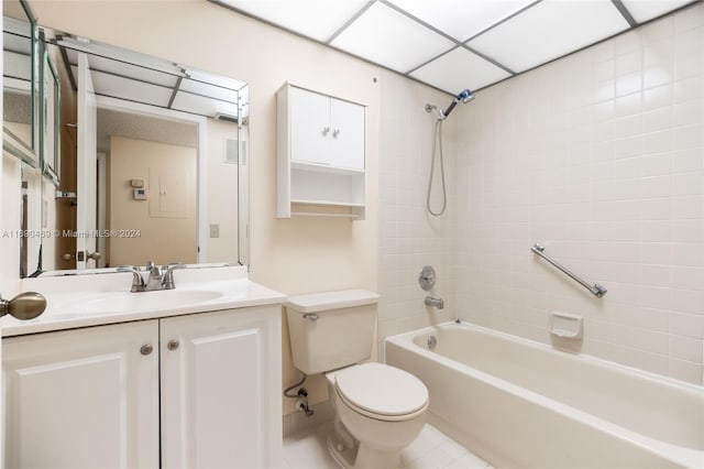 full bathroom featuring vanity, tile patterned flooring, tiled shower / bath, and toilet