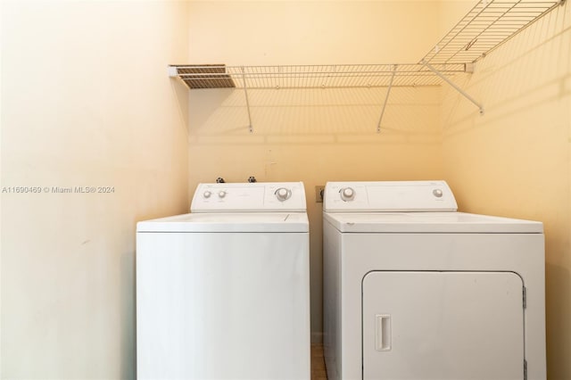 washroom featuring washer and dryer