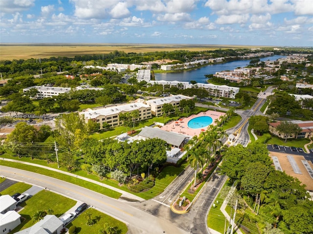 birds eye view of property featuring a water view