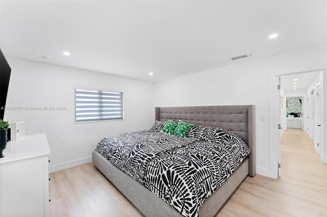 bedroom with light wood-type flooring