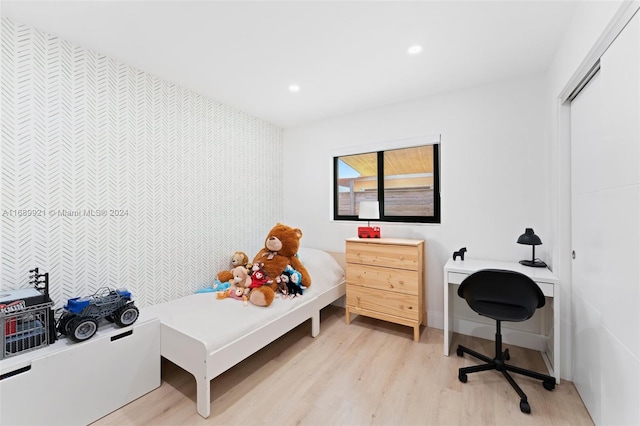 bedroom with light wood-type flooring