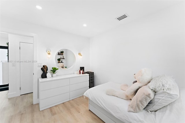 bedroom with light hardwood / wood-style flooring