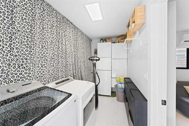 interior space featuring washing machine and clothes dryer and tile patterned flooring