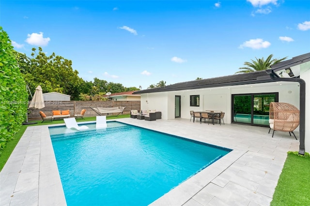 view of pool featuring a patio