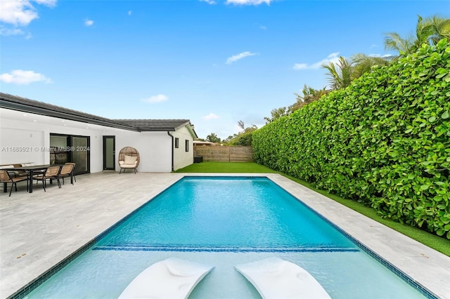 view of pool featuring a patio