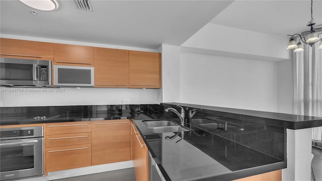 kitchen featuring sink, stainless steel appliances, and dark wood-type flooring