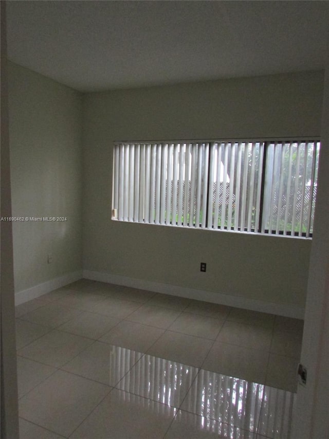 view of tiled spare room