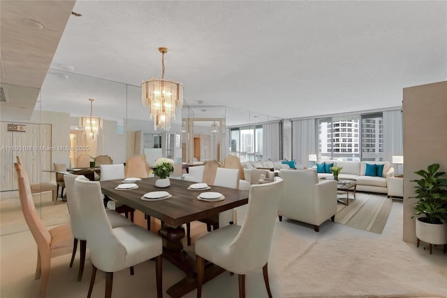 dining area with an inviting chandelier, visible vents, and light colored carpet